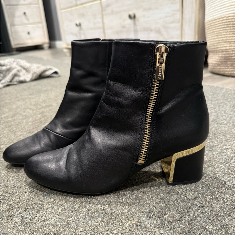 DKNY Black and Gold Heeled Boots with Sleek Design
